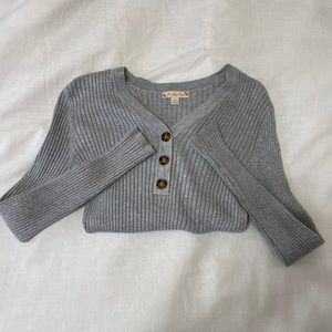 grey button-up sweater